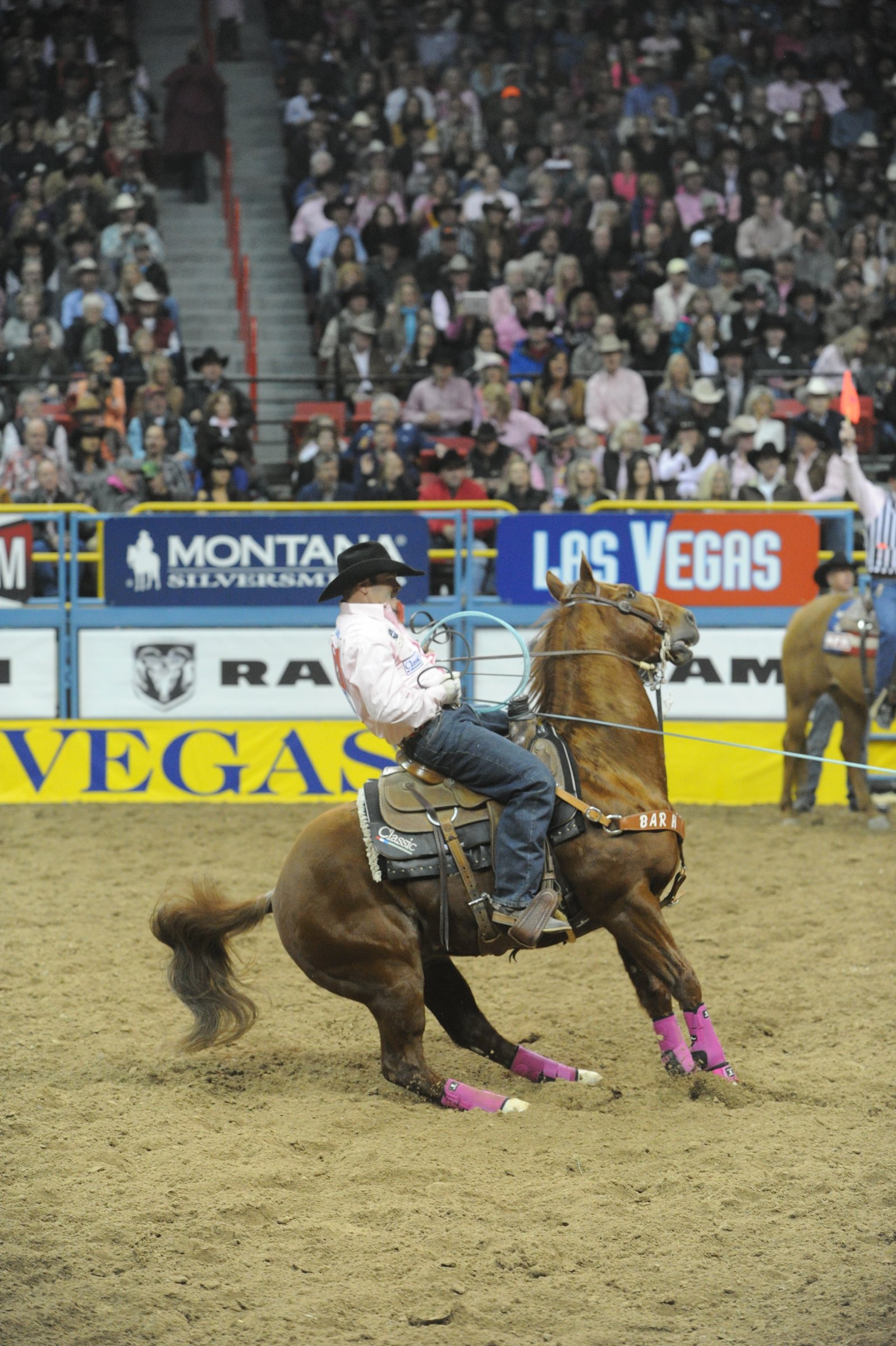 Ryan Motes stopping hard on his rope horse at the Wrangler NFR in Las Vegas